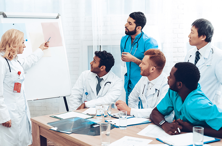 Female doctor training other doctors