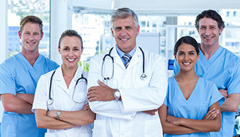 Doctors-1-home Doctors standing with arms crossed
